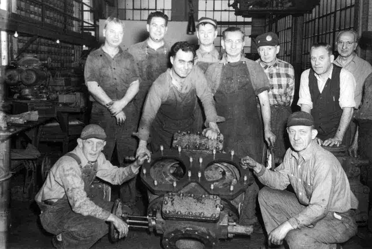 black and white photo of shop employees